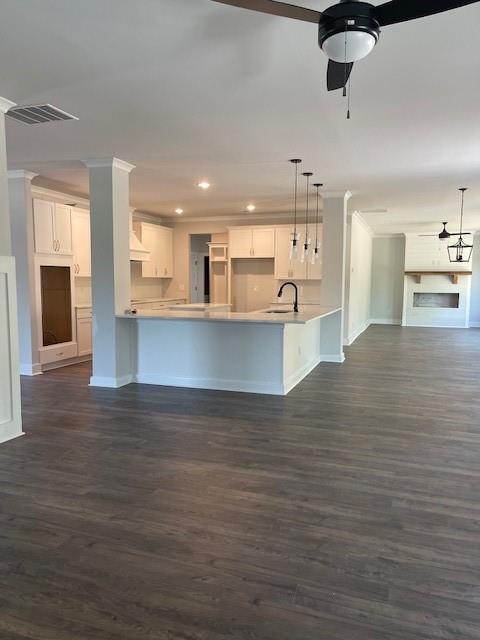 222 Silvercrest Dr, Acworth, GA 30101 - kitchen with open floor plan, a sink, baseboards, dark wood-style floors, and a peninsula