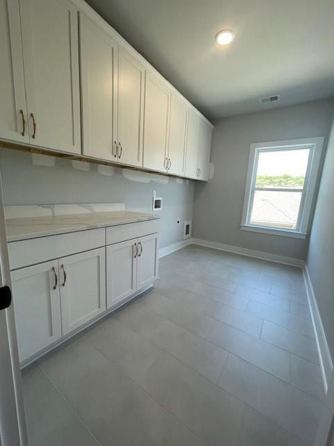 222 Silvercrest Dr, Acworth, GA 30101 - laundry area featuring hookup for an electric dryer, washer hookup, cabinet space, baseboards, and recessed lighting
