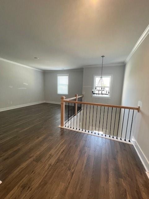 222 Silvercrest Dr, Acworth, GA 30101 - spare room featuring ornamental molding, dark wood-style floors, healthy amount of natural light, and baseboards