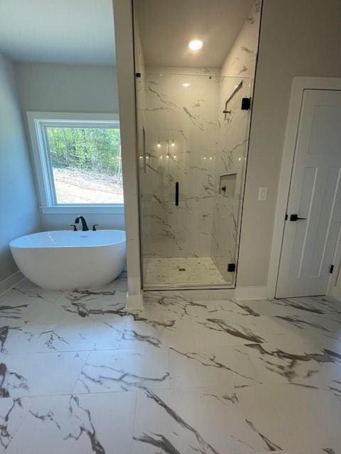 222 Silvercrest Dr, Acworth, GA 30101 - bathroom featuring a marble finish shower, baseboards, a soaking tub, and marble finish flooring