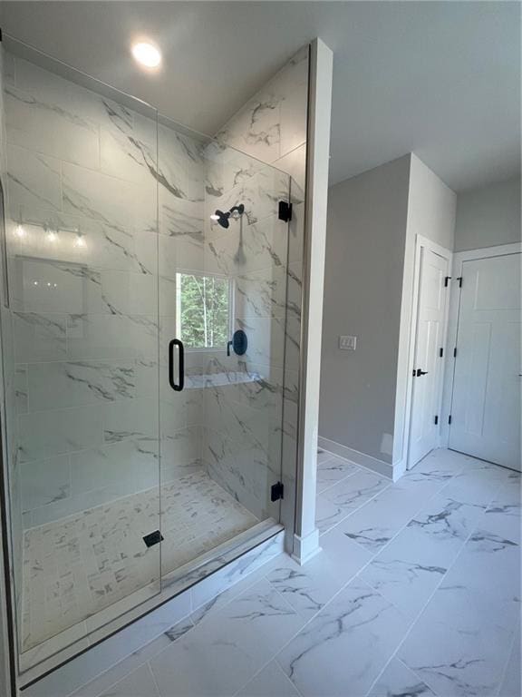 222 Silvercrest Dr, Acworth, GA 30101 - bathroom featuring marble finish flooring, a marble finish shower, and baseboards