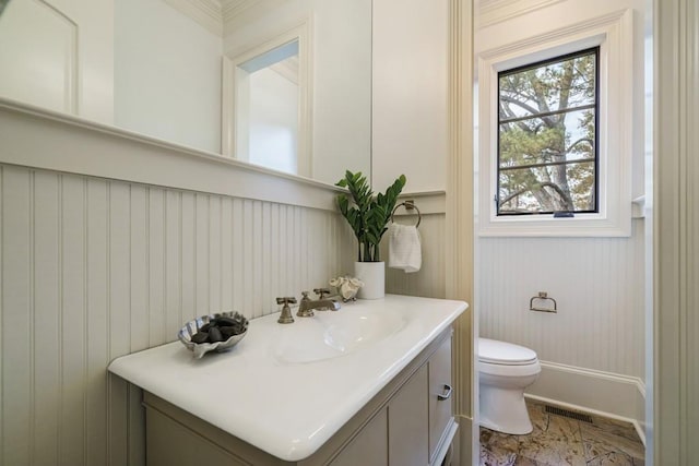 bathroom featuring oversized vanity, toilet, and tile floors