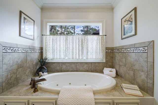 bathroom with tiled bath and ornamental molding