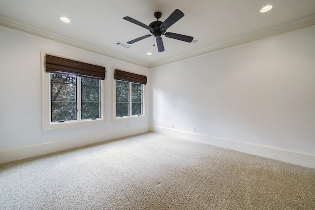 carpeted empty room with ceiling fan and ornamental molding