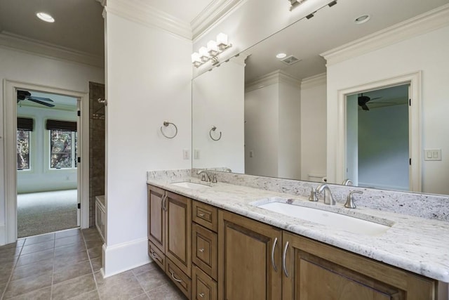 bathroom with toilet, double sink vanity, ceiling fan, ornamental molding, and tile floors