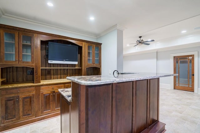 bar featuring light tile flooring, ornamental molding, ceiling fan, and light stone counters