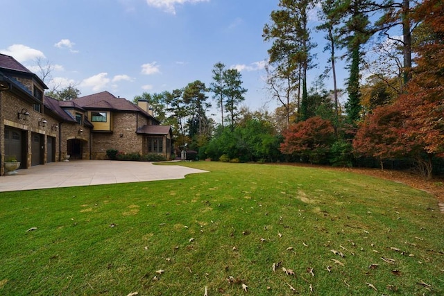 view of yard featuring a garage