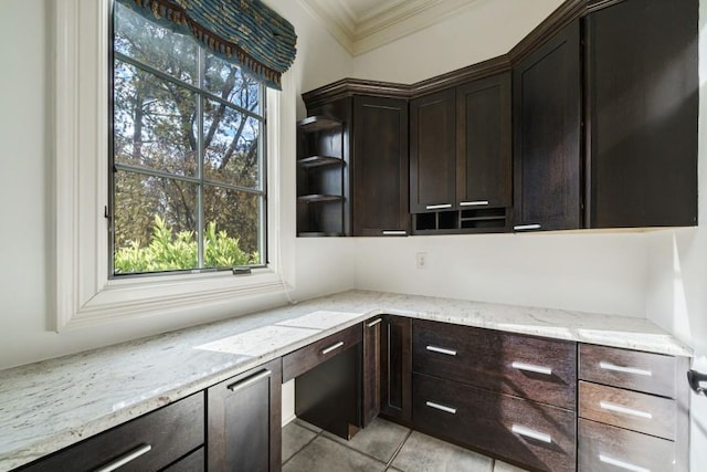 interior space with light stone countertops, dark brown cabinetry, light tile flooring, and ornamental molding