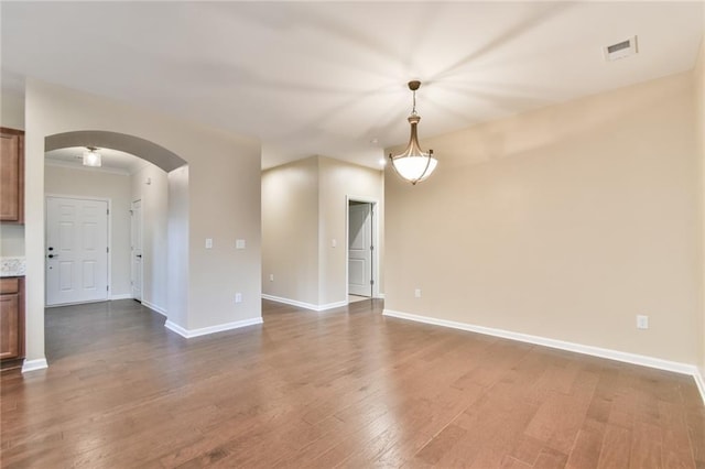 spare room with hardwood / wood-style floors