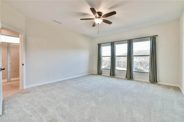 carpeted empty room with ceiling fan