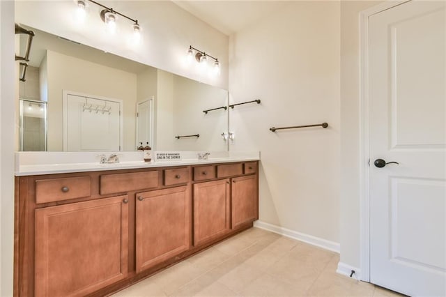 bathroom with tile patterned flooring and vanity