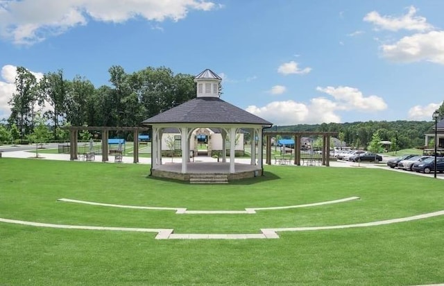 view of community with a gazebo and a lawn