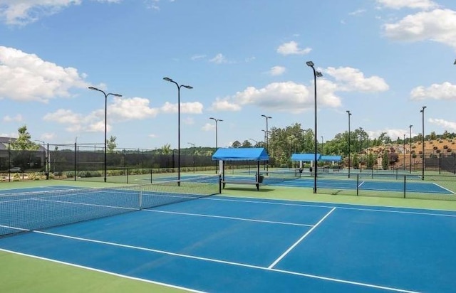 view of sport court with basketball hoop