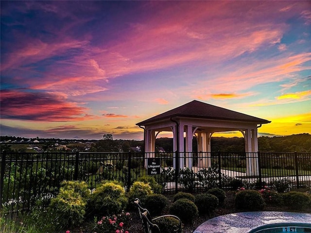 patio terrace at dusk featuring a gazebo