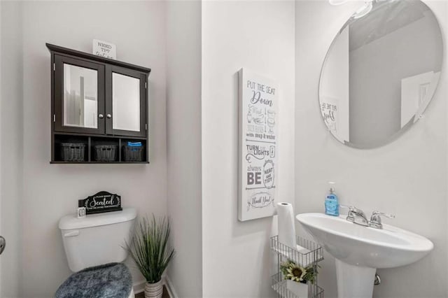 bathroom with a sink and toilet