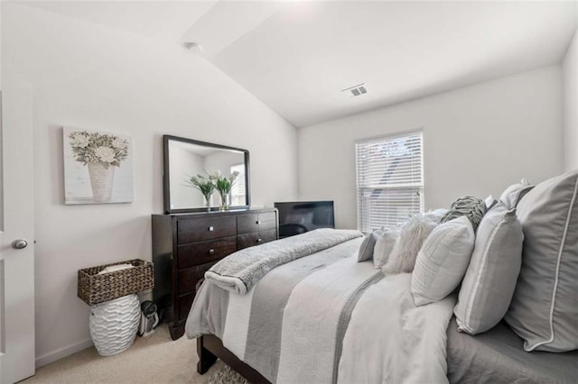 carpeted bedroom featuring visible vents, baseboards, and lofted ceiling