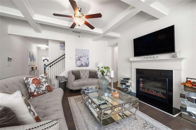 living room featuring crown molding, visible vents, stairway, wood finished floors, and coffered ceiling