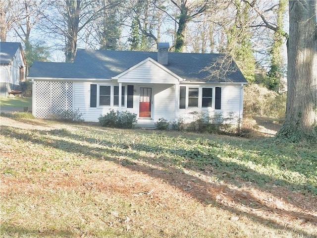 ranch-style home with a front lawn