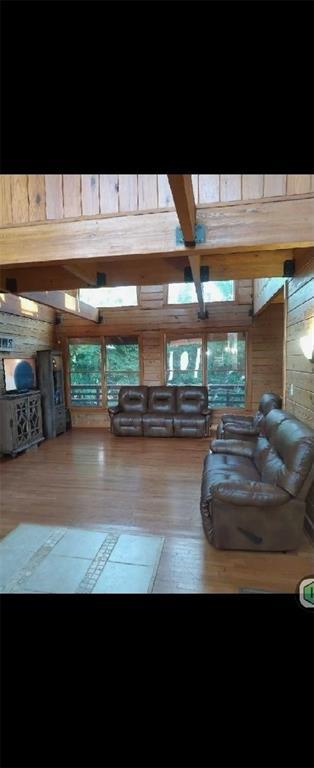 524 Bethany Church Rd SW, Crawfordville, GA 30631 - living room featuring wood finished floors and wood walls