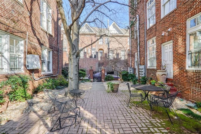 690 Piedmont Ave NE Unit 17, Atlanta, GA 30308 - view of patio featuring outdoor dining area and fence