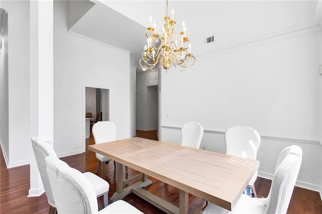 385 Windermere Cir, Newnan, GA 30265 - dining room with a chandelier, wood finished floors, and crown molding