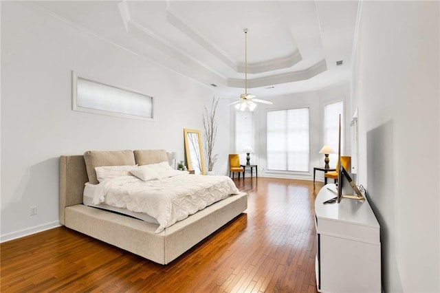 385 Windermere Cir, Newnan, GA 30265 - bedroom featuring a raised ceiling, wood-type flooring, baseboards, crown molding, and ceiling fan