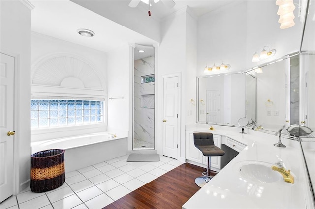 385 Windermere Cir, Newnan, GA 30265 - full bath with a garden tub, double vanity, a stall shower, ceiling fan, and tile patterned floors