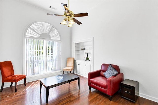 385 Windermere Cir, Newnan, GA 30265 - sitting room with ceiling fan, wood finished floors, baseboards, crown molding, and a high ceiling