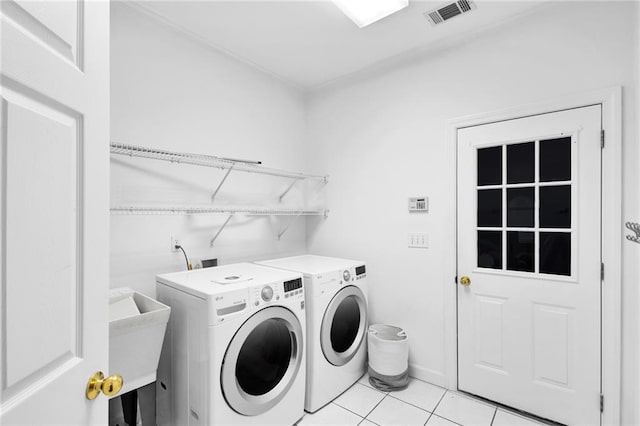 385 Windermere Cir, Newnan, GA 30265 - washroom with washing machine and clothes dryer and light tile patterned floors