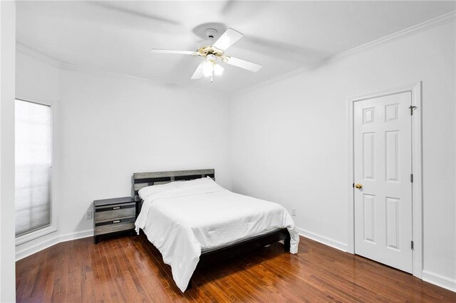 385 Windermere Cir, Newnan, GA 30265 - bedroom featuring ornamental molding, wood finished floors, multiple windows, baseboards, and a ceiling fan
