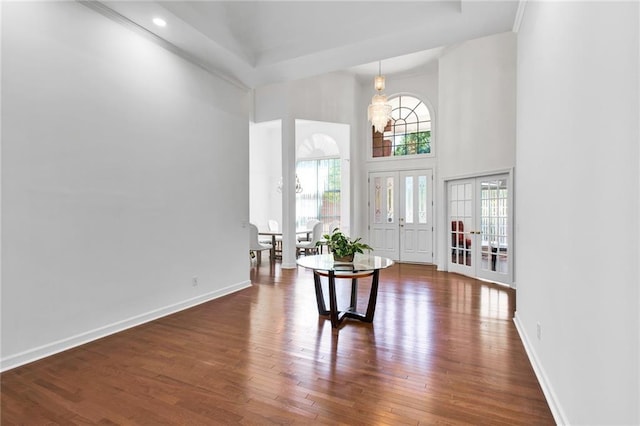 385 Windermere Cir, Newnan, GA 30265 - foyer featuring a high ceiling, wood finished floors, french doors, a chandelier, and baseboards