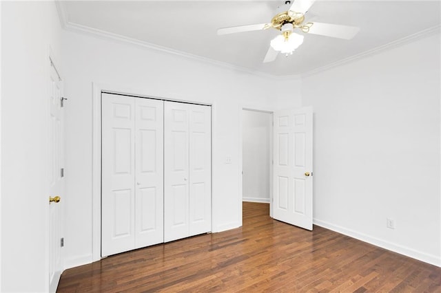 385 Windermere Cir, Newnan, GA 30265 - unfurnished bedroom with ornamental molding, wood finished floors, a closet, ceiling fan, and baseboards