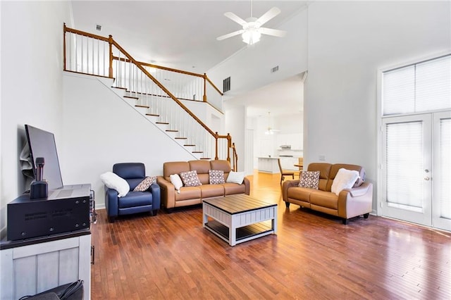 385 Windermere Cir, Newnan, GA 30265 - living area featuring high vaulted ceiling, stairway, a ceiling fan, wood finished floors, and french doors