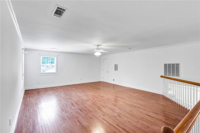 385 Windermere Cir, Newnan, GA 30265 - unfurnished room featuring a ceiling fan, crown molding, light wood-style flooring, and baseboards