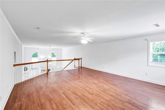 385 Windermere Cir, Newnan, GA 30265 - unfurnished room featuring a ceiling fan, wood finished floors, baseboards, and crown molding