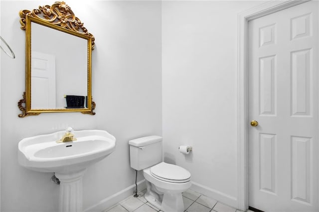 385 Windermere Cir, Newnan, GA 30265 - half bath featuring baseboards, toilet, and tile patterned flooring