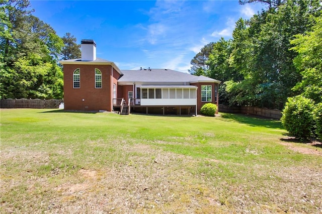 385 Windermere Cir, Newnan, GA 30265 - back of property with a chimney and a sunroom