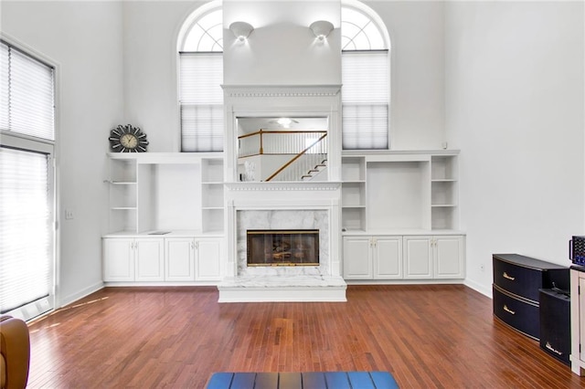 385 Windermere Cir, Newnan, GA 30265 - unfurnished living room featuring healthy amount of natural light and dark wood-style floors