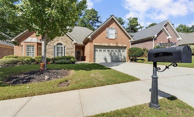 traditional-style home with driveway, a garage, stone siding, a front lawn, and brick siding