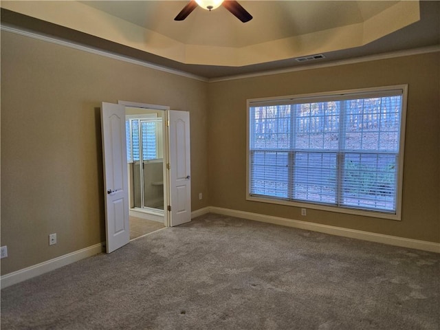 2110 Retreat Haven Ln, Dacula, GA 30019 - unfurnished room with a tray ceiling, a ceiling fan, carpet flooring, and baseboards