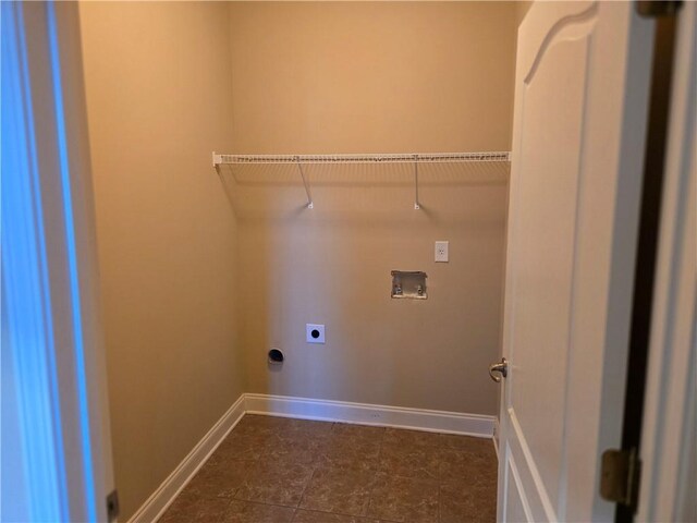 2110 Retreat Haven Ln, Dacula, GA 30019 - clothes washing area with electric dryer hookup, washer hookup, and baseboards