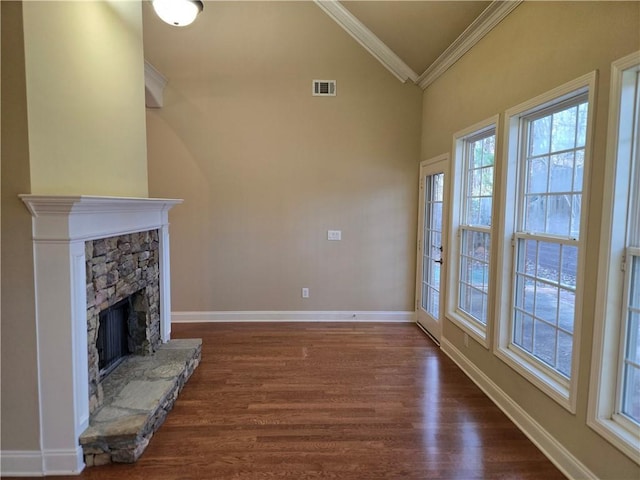 2110 Retreat Haven Ln, Dacula, GA 30019 - unfurnished living room with a fireplace, ornamental molding, dark wood finished floors, high vaulted ceiling, and baseboards