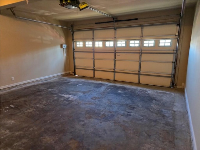 2110 Retreat Haven Ln, Dacula, GA 30019 - garage with a garage door opener and baseboards