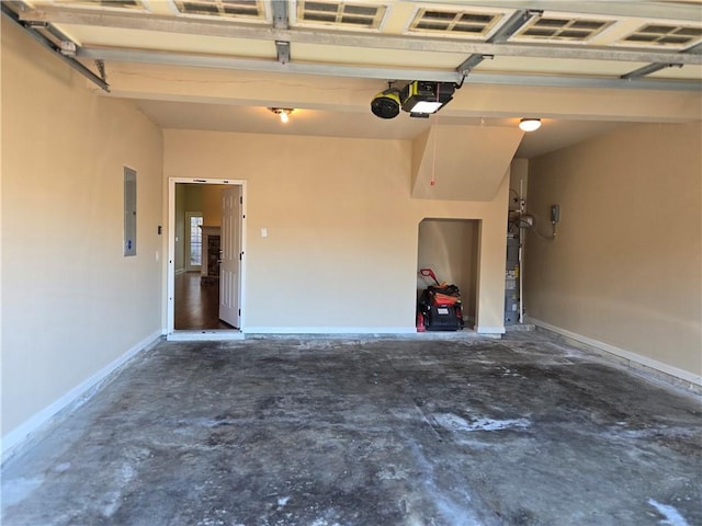 2110 Retreat Haven Ln, Dacula, GA 30019 - garage featuring a garage door opener, electric panel, and baseboards