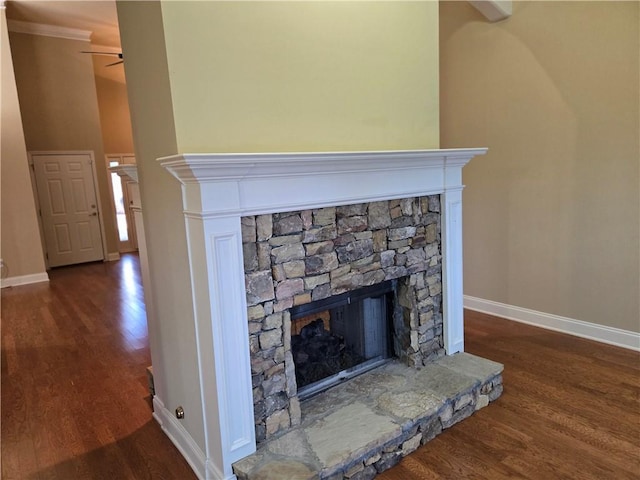 2110 Retreat Haven Ln, Dacula, GA 30019 - detailed view of wood finished floors, a stone fireplace, baseboards, and a ceiling fan