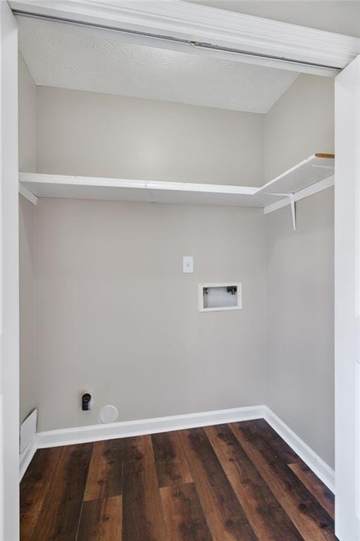 laundry room with washer hookup and dark hardwood / wood-style floors