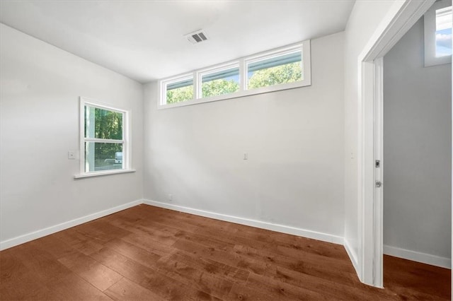 empty room featuring wood-type flooring