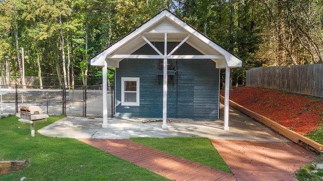 view of outdoor structure featuring a lawn