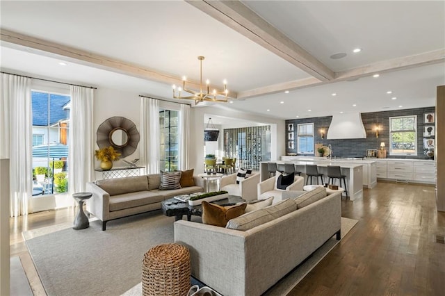 living room with recessed lighting, beamed ceiling, a notable chandelier, and hardwood / wood-style floors