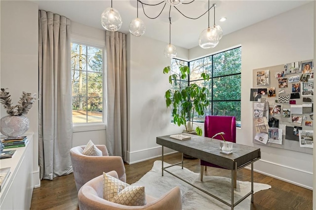 home office featuring baseboards and wood finished floors